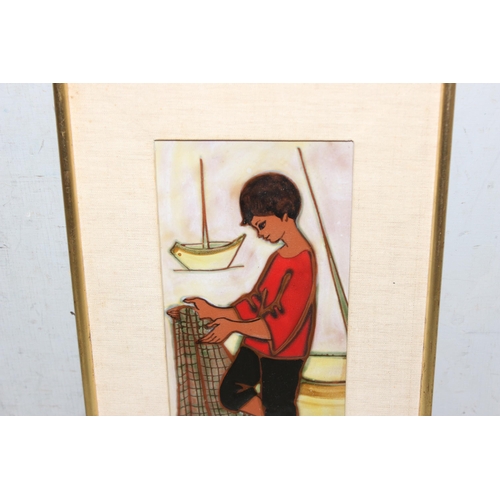 413 - Maria Lluis (b.1931), a retro framed pottery tile by Sant-Vicens depicting a fisherboy with net, app... 