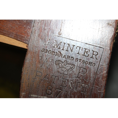 123 - George Minter of Soho - an unusual William IV period green upholstered and mahogany library armchair... 