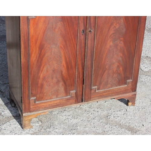 126 - Antique flamed mahogany closed fronted bookcase, approx 95cm W x 41cm D x 135cm H