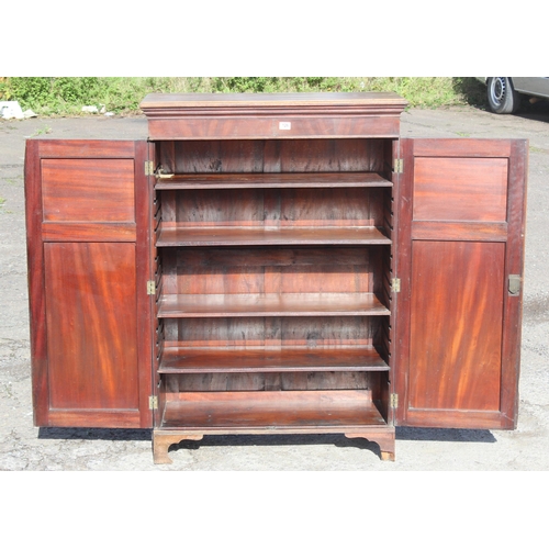 126 - Antique flamed mahogany closed fronted bookcase, approx 95cm W x 41cm D x 135cm H