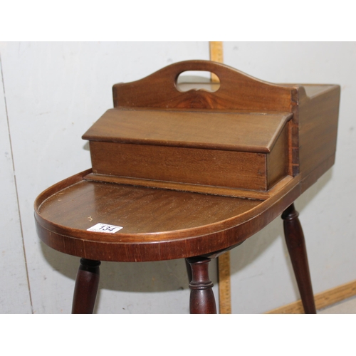 134 - Unusual Regency period mahogany butler's Canterbury or serving table, shaped top with removable box ... 