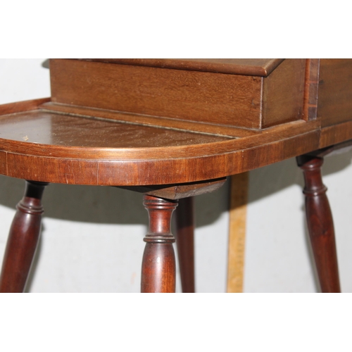 134 - Unusual Regency period mahogany butler's Canterbury or serving table, shaped top with removable box ... 