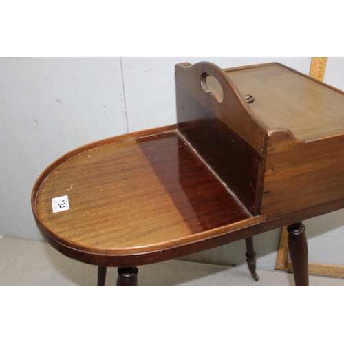 134 - Unusual Regency period mahogany butler's Canterbury or serving table, shaped top with removable box ... 