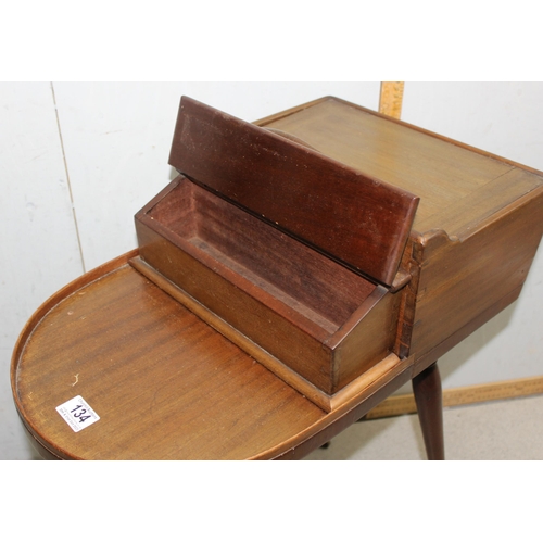 134 - Unusual Regency period mahogany butler's Canterbury or serving table, shaped top with removable box ... 