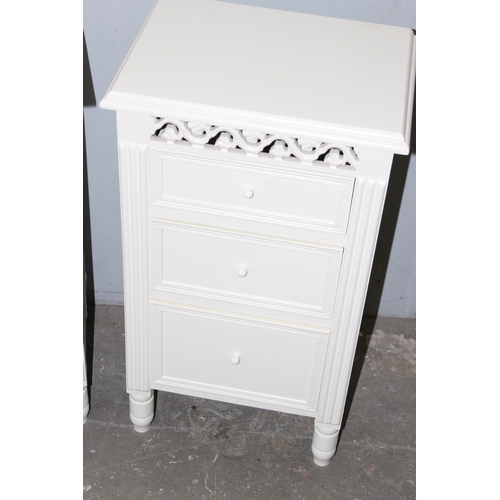 143 - Matched pair of modern white bedside tables, 1 with 3 graduated drawers and the other a drawer over ... 