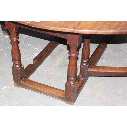 145 - 18th century oak gate legged table, approx 169cm x 142cm x 65cm