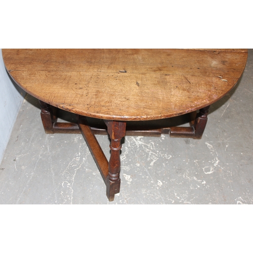 145 - 18th century oak gate legged table, approx 169cm x 142cm x 65cm