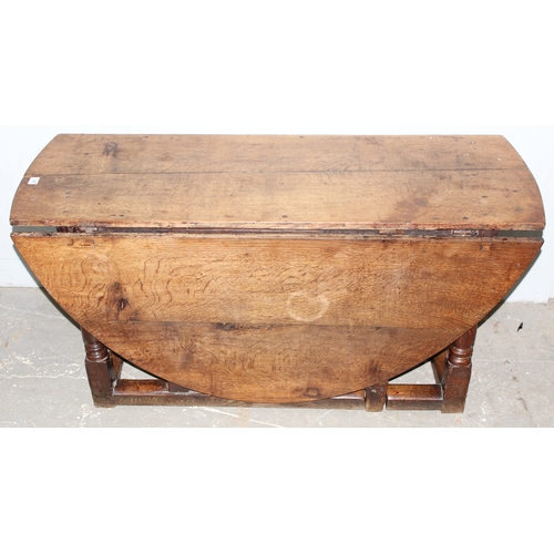 145 - 18th century oak gate legged table, approx 169cm x 142cm x 65cm