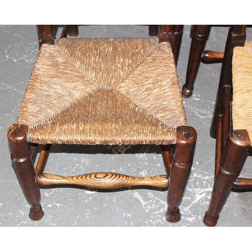 146 - A matched set of 8 Arts & Crafts period oak spindle back dining chairs with rush seats