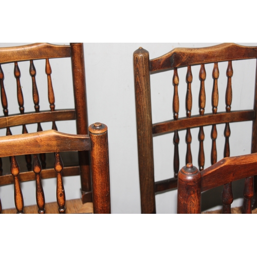 146 - A matched set of 8 Arts & Crafts period oak spindle back dining chairs with rush seats