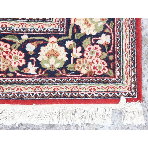 214 - A fine quality red ground rug, believed to be silk and of Turkish origin, possibly Hereke, approx. 1... 