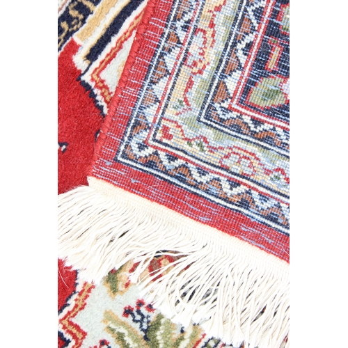 214 - A fine quality red ground rug, believed to be silk and of Turkish origin, possibly Hereke, approx. 1... 