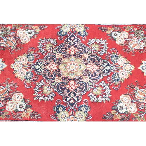 214 - A fine quality red ground rug, believed to be silk and of Turkish origin, possibly Hereke, approx. 1... 