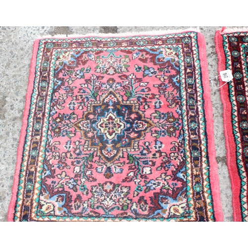 216 - 2 small red ground Persian Hamadan rugs, the larger approx 67cm x 84cm