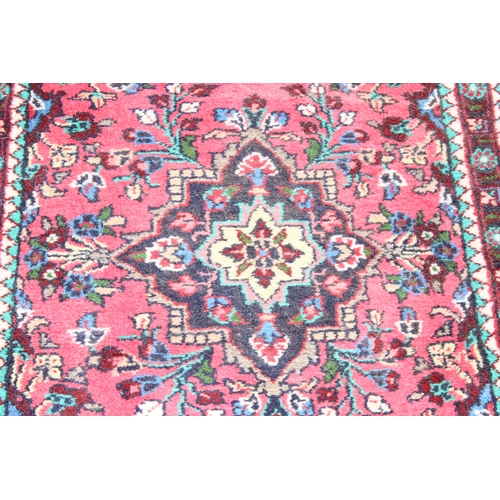 216 - 2 small red ground Persian Hamadan rugs, the larger approx 67cm x 84cm