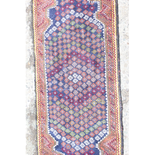 219 - A long vintage Persian hall runner rug of dark blue ground, extremely fine knot structure, approx 37... 