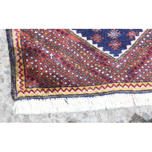 219 - A long vintage Persian hall runner rug of dark blue ground, extremely fine knot structure, approx 37... 