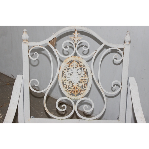 328 - A Victorian style wrought iron garden rocking chair, approx 65cm W x 94cm D x 91cm H