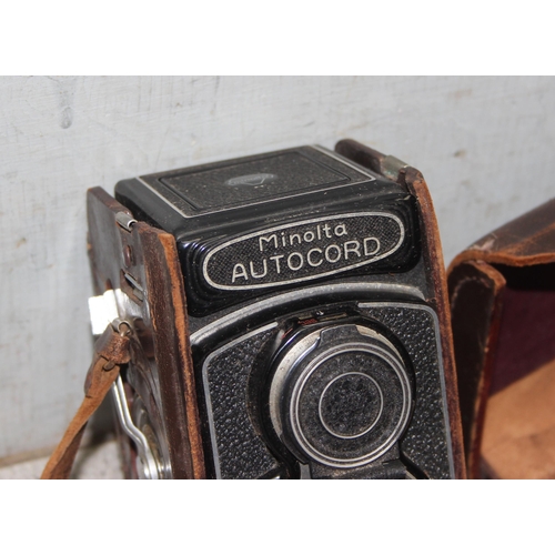 657 - A vintage Minolta Autocord TLR camera in leather case