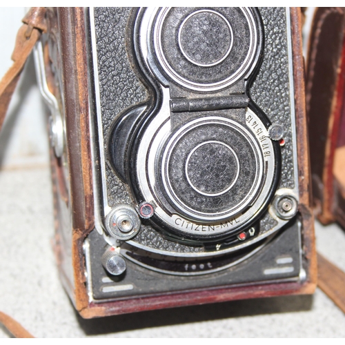 657 - A vintage Minolta Autocord TLR camera in leather case