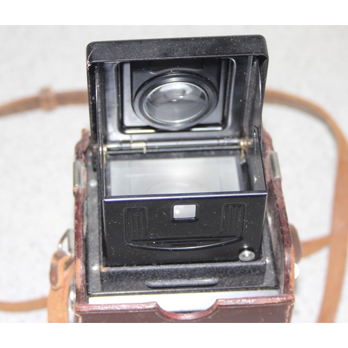 657 - A vintage Minolta Autocord TLR camera in leather case