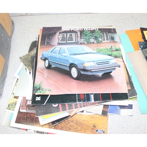 711 - A large qty of vintage car brochures and magazines