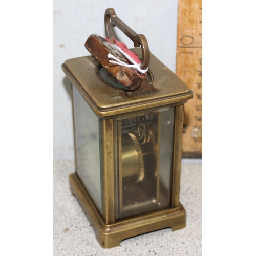 1319 - A vintage brass cased carriage clock with enamel dial and French mechanical movement