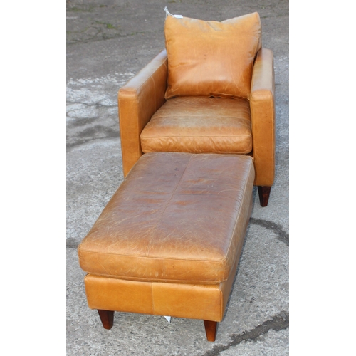 140A - Tan leather armchair with matching footstool, (John Lewis Label to footstool) chair approx 77cm W x ... 