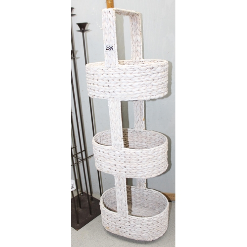 285 - 9 branch modernist floor standing tea light stand and a 3 tier floor standing basket