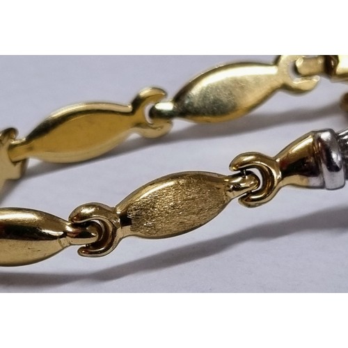 1119 - A 14ct white and yellow gold bracelet set with small white stones, marked 585 and XRF confirmed, app... 