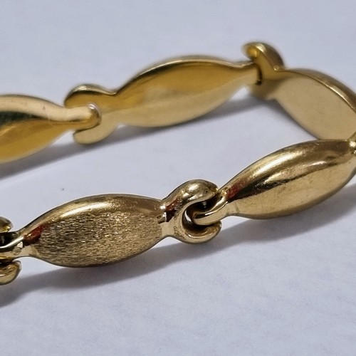 1119 - A 14ct white and yellow gold bracelet set with small white stones, marked 585 and XRF confirmed, app... 