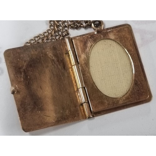 1108 - 9ct gold locket pendant formed as a book, on 9ct gold chain, London 1957, chain approx 38cm long, ap... 