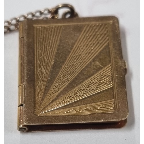 1108 - 9ct gold locket pendant formed as a book, on 9ct gold chain, London 1957, chain approx 38cm long, ap... 