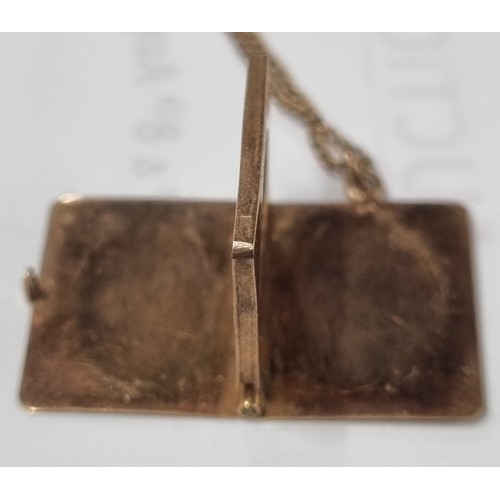 1108 - 9ct gold locket pendant formed as a book, on 9ct gold chain, London 1957, chain approx 38cm long, ap... 