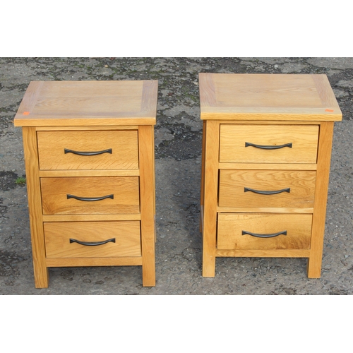 15 - Pair of light oak 3-drawer bedside tables with iron handles, approx 42cm W x 35cm D x 58cm H