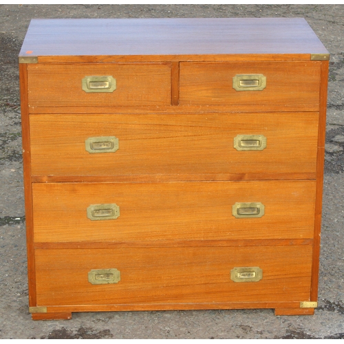 6 - A vintage 2 over 3 campaign style chest of drawers with recessed brass handles and brass corners, po... 