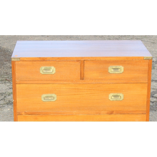 6 - A vintage 2 over 3 campaign style chest of drawers with recessed brass handles and brass corners, po... 