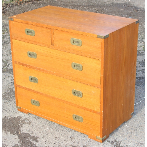 6 - A vintage 2 over 3 campaign style chest of drawers with recessed brass handles and brass corners, po... 