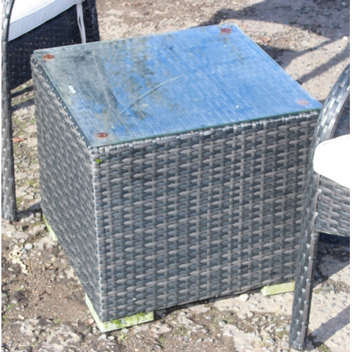 300 - Rattan garden seat set comprising 2 arm chairs and glass-topped cube table (50cm x 50cm x 45cm)