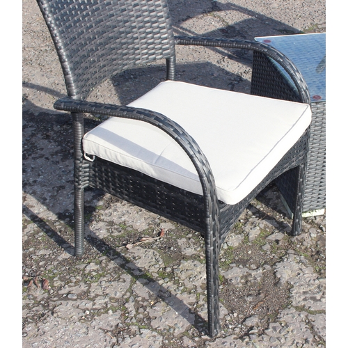 300 - Rattan garden seat set comprising 2 arm chairs and glass-topped cube table (50cm x 50cm x 45cm)