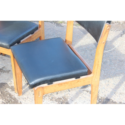 8 - 5 retro Danish style mid-century teak chairs to incl 1 carver, with black vinyl upholstery, possibly... 