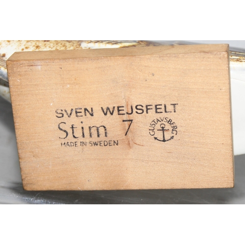 1637 - Sven Wejsfelt for Gustavberg, a ceramic fish on a wooden stand, the stand with printed makers marks,... 