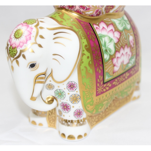 1640 - Royal Crown Derby 'Mother Indian Elephant' with gold, pink and green decoration, approx 11.5cm tall