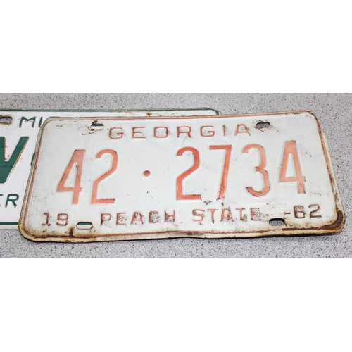 709 - 4 vintage American car 'registration tags'