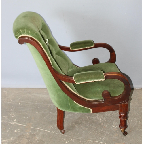 80 - Antique button back green upholstered mahogany framed library chair with scroll arms and ceramic cas... 