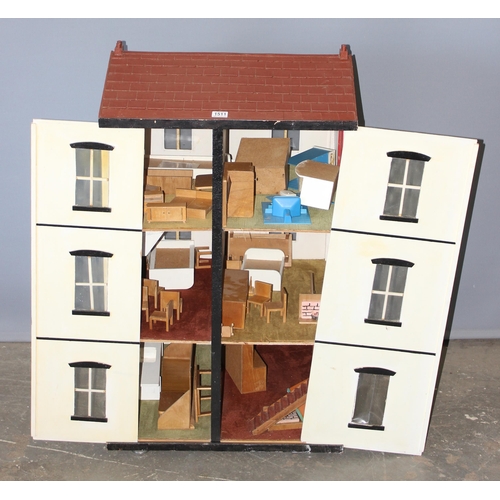 1511 - A large vintage wooden dolls house with a large qty of furniture and accessories, approx 64cm wide x... 