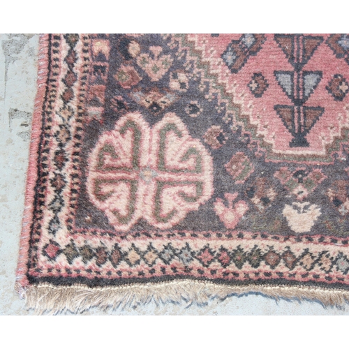 204 - A vintage Persian red ground rug, possibly Senneh, likely early 20th century, approx 180cm x 73cm