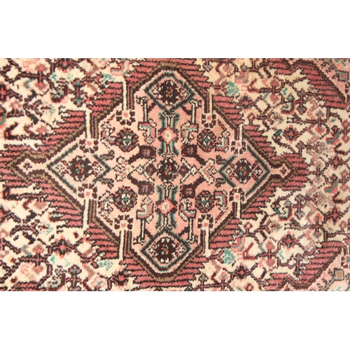 205 - A vintage Persian red and cream ground rug, possibly Senneh, likely mid 20th century, approx 130cm x... 