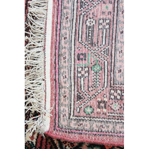 205 - A vintage Persian red and cream ground rug, possibly Senneh, likely mid 20th century, approx 130cm x... 