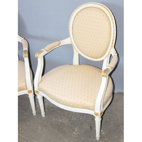 71 - A pair of regency style Fauteuil chairs with shield backs, pattered light upholstery with white pain... 